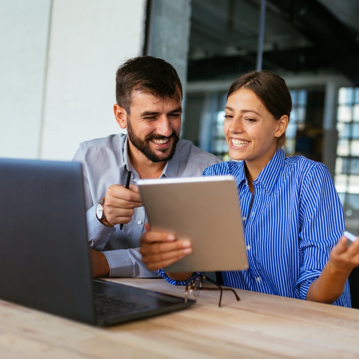 employees working together on new software that's been implemented (business central)