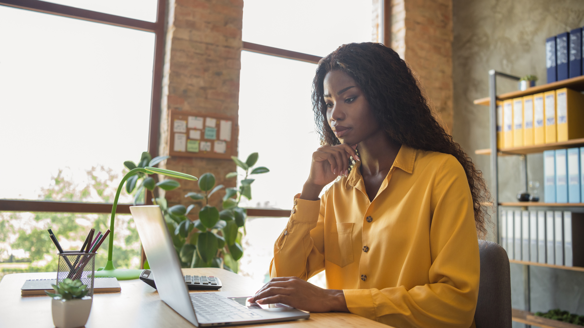 Woman looking at payroll on a laptop